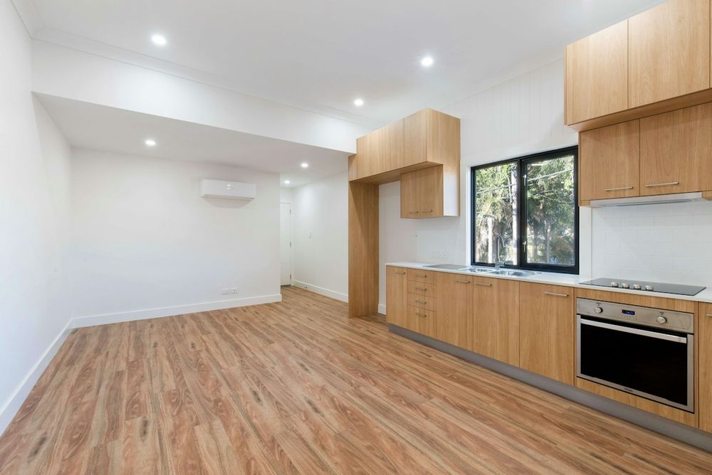 Empty room with kitchen cabinets